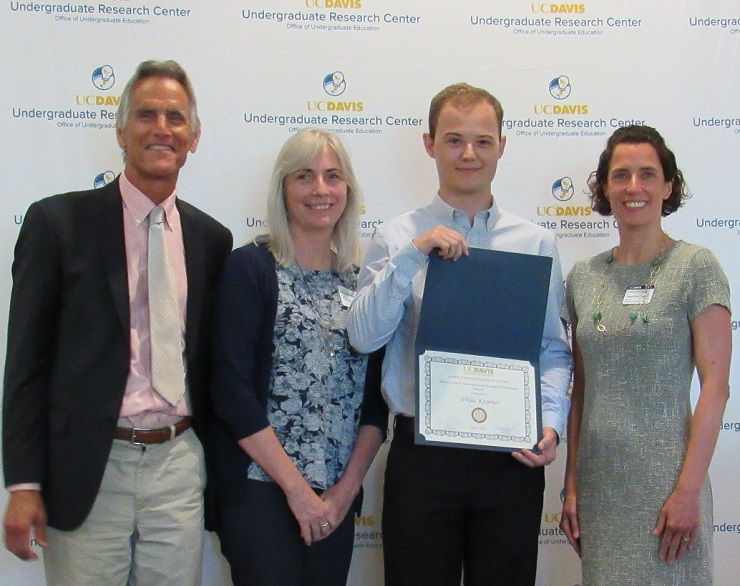 Photo of Steve and Karen Hanson, Niklas Kraemer holding his certificate and Annaliese Franz