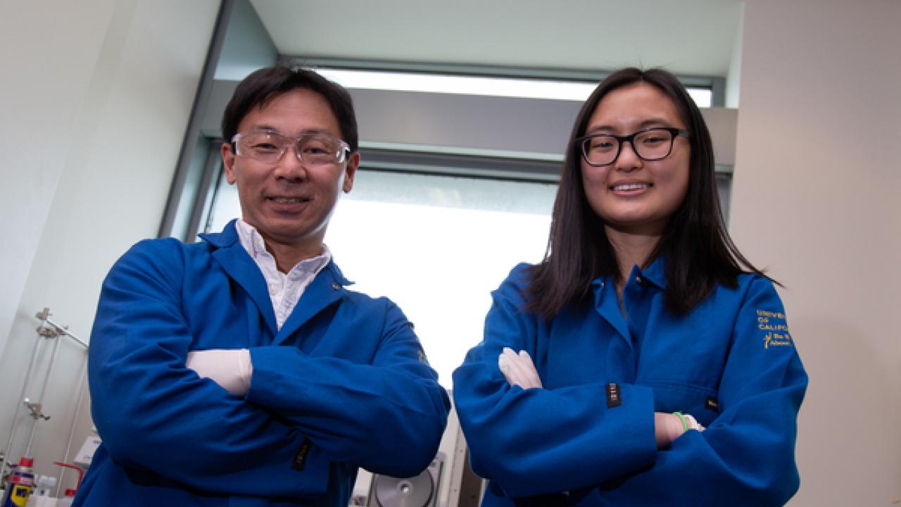 Photo of Joleen Cheah next to Associate Professor Soichiro Yamada in blue labcoats