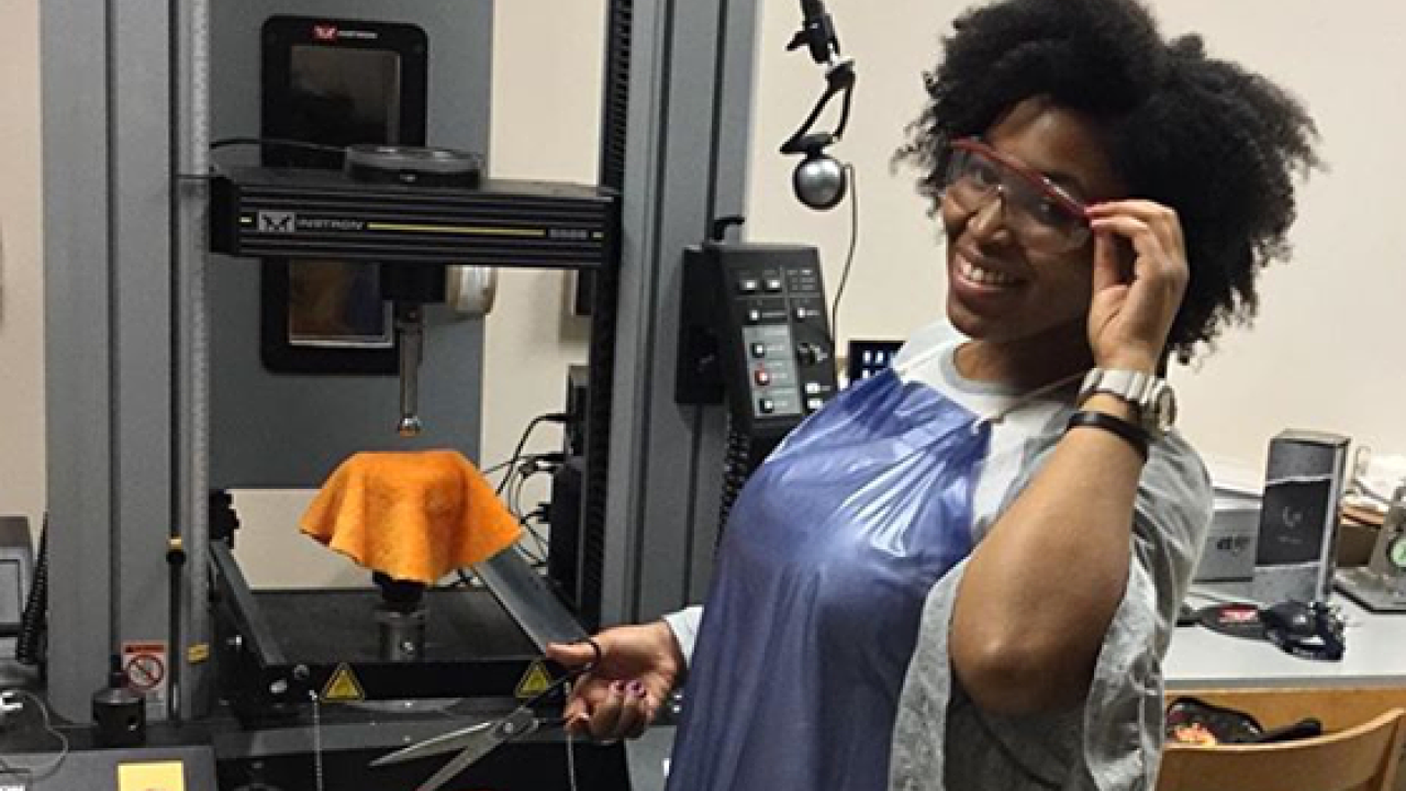 Undergraduate Research Photo Contest Winner, Nicole Chanel -Textile and Design Major Photo Contest Winner, Nicole Chanel testing textile strength