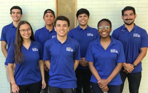 Group photo of CAMP participants in blue CAMP shirts
