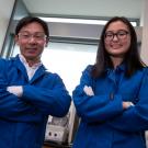 Photo of Joleen Cheah next to Associate Professor Soichiro Yamada in blue labcoats